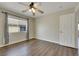 Cozy bedroom with wood floor, ceiling fan and window at 8287 Lincoln Valley St, Las Vegas, NV 89123