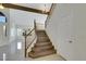 Welcoming entryway with hardwood staircase and ample natural light at 8287 Lincoln Valley St, Las Vegas, NV 89123