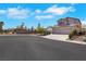 Beautiful home exterior featuring desert landscaping and a spacious three-car garage; perfect for a Gathering at 8287 Lincoln Valley St, Las Vegas, NV 89123