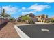 Attractive exterior view showcasing the home's three-car garage, desert landscaping, and well-maintained surroundings at 8287 Lincoln Valley St, Las Vegas, NV 89123