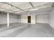 An empty two car garage with ample room for storage and vehicles, ready for customization at 8287 Lincoln Valley St, Las Vegas, NV 89123