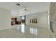 Open living room boasts a stone fireplace, shuttered windows and backyard access at 8287 Lincoln Valley St, Las Vegas, NV 89123