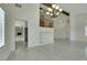 Spacious living room with modern lighting, stone fireplace, staircase and balcony at 8287 Lincoln Valley St, Las Vegas, NV 89123