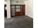 Spacious living room featuring built-in shelving and neutral carpeting at 830 Carnegie St # 1811, Henderson, NV 89052