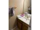 Cozy bathroom featuring a sink and vanity with neutral-colored walls at 890 Ripple Way, Las Vegas, NV 89110