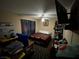 Comfortable bedroom with a ceiling fan and a TV, offering a private retreat within the home at 890 Ripple Way, Las Vegas, NV 89110