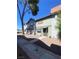 Charming townhome showcasing a well-maintained exterior with a welcoming entrance and landscaped surroundings at 890 Ripple Way, Las Vegas, NV 89110