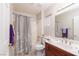 Cozy bathroom featuring a shower-tub combination, a vanity, and tile flooring at 8904 Marble Dr, Las Vegas, NV 89134