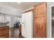 Bright kitchen showcasing modern white refrigerator and wood cabinetry at 8904 Marble Dr, Las Vegas, NV 89134