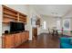 Spacious living room features hardwood floors, built-in shelving and bright light from the large windows at 8904 Marble Dr, Las Vegas, NV 89134