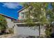 Charming two-story home with a two-car garage and mature tree at 10004 Pasque Flower Ct, Las Vegas, NV 89178