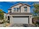 Charming two-story home with a two-car garage and well-maintained landscaping at 10004 Pasque Flower Ct, Las Vegas, NV 89178