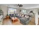 Spacious living room with a large sectional sofa and ample natural light at 10004 Pasque Flower Ct, Las Vegas, NV 89178