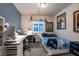 A bedroom with a desk, large window, and decorations, offering a comfortable and stylish space at 10125 Sequoia Falls Pl, Las Vegas, NV 89149