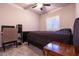 Bedroom featuring a window with shutters and a ceiling fan at 10125 Sequoia Falls Pl, Las Vegas, NV 89149