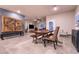 Open-concept dining area features a wooden cabinet, tile flooring and an adjacent living area at 10125 Sequoia Falls Pl, Las Vegas, NV 89149