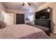 A well-appointed primary bedroom featuring a barn door, a large bed, and stylish furnishings at 10125 Sequoia Falls Pl, Las Vegas, NV 89149