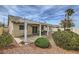 Cozy back patio with a white pergola and outdoor seating in a well-maintained yard at 1022 Atticus Ave, Henderson, NV 89015
