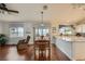 Open dining area with wood floors, natural light, and backyard views at 1022 Atticus Ave, Henderson, NV 89015