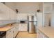 Modern kitchen with stainless steel refrigerator and spacious countertops at 1022 Atticus Ave, Henderson, NV 89015