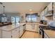 Bright kitchen featuring granite countertops, white cabinets, and stainless steel appliances at 1022 Atticus Ave, Henderson, NV 89015