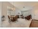 Open-concept living room and dining area with stylish furnishings and bright neutral walls at 1022 Atticus Ave, Henderson, NV 89015
