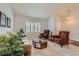 Comfortable living room featuring plush seating, patterned rug, and natural light at 1022 Atticus Ave, Henderson, NV 89015