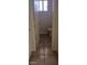 Bathroom view, showing toilet and window with neutral tile flooring and clean fixtures at 1832 Lewis Ave, Las Vegas, NV 89101