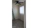 Apartment bedroom with tile floors, vertical blinds, and ladder at 1832 Lewis Ave, Las Vegas, NV 89101