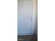 White front door with security bars, offers a secure entrance with classic design elements at 1832 Lewis Ave, Las Vegas, NV 89101
