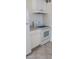 Cozy kitchen with white appliances and cabinets, maximizing space and functionality at 1832 Lewis Ave, Las Vegas, NV 89101