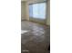 Bright living room with tile floors and large window with blinds, creating a versatile living space at 1832 Lewis Ave, Las Vegas, NV 89101