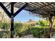 Charming backyard patio with pergola, lush greenery, and decorative accents; perfect for outdoor relaxation and entertaining at 1905 Calle De Espana, Las Vegas, NV 89102