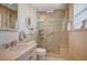 Bright bathroom featuring a walk-in shower with glass door, vanity with white cabinets, and tiled floors at 1905 Calle De Espana, Las Vegas, NV 89102