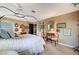 Light-filled bedroom showcasing a decorative bed, ample lighting, and carefully selected furnishings for a cozy atmosphere at 1905 Calle De Espana, Las Vegas, NV 89102