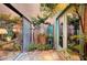 Charming courtyard with rock ground cover, fountain, and access to the home's interior through sliding glass doors at 1905 Calle De Espana, Las Vegas, NV 89102