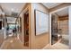 Long hallway with multiple rooms, hardwood floors, and decorated with elegant artwork at 1905 Calle De Espana, Las Vegas, NV 89102