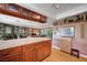 Open concept kitchen with a large island, stainless steel appliances, and seamless flow into the living area at 1905 Calle De Espana, Las Vegas, NV 89102