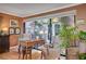 Cozy sun room with large windows overlooking a lush garden, perfect for relaxing or reading at 1905 Calle De Espana, Las Vegas, NV 89102