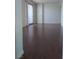 Spacious living room with hardwood floors and sliding glass doors to balcony at 200 W Sahara Ave # 3412, Las Vegas, NV 89102