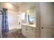 Bright bathroom with vanity, mirror, and shower/tub combo at 2111 Loro Ct, Las Vegas, NV 89117