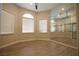 Large bedroom with wood look flooring, shelving, and plenty of natural light at 2111 Loro Ct, Las Vegas, NV 89117