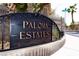 Paloma Estates community sign with lush landscaping and gated entrance at 2111 Loro Ct, Las Vegas, NV 89117