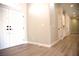 Open-concept entry foyer with beautiful vinyl floors, lighting, and an entry door at 2111 Loro Ct, Las Vegas, NV 89117