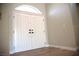 Bright foyer with a stunning entry door, recessed lights, and wood-look floors at 2111 Loro Ct, Las Vegas, NV 89117
