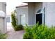 Charming home exterior with manicured landscaping, a private walkway, and front door at 2111 Loro Ct, Las Vegas, NV 89117