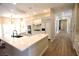Modern kitchen with white cabinets, marble countertops, an island sink, and modern appliances at 2111 Loro Ct, Las Vegas, NV 89117