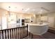 Gourmet kitchen with white cabinets, an island bar, and stainless steel appliances at 2111 Loro Ct, Las Vegas, NV 89117