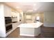 Modern kitchen featuring stainless appliances, white cabinets and beautiful marble countertops at 2111 Loro Ct, Las Vegas, NV 89117