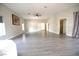 Open living room featuring hardwood floors, natural lighting and multiple entryways at 2111 Loro Ct, Las Vegas, NV 89117